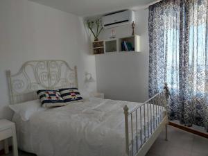 A bed or beds in a room at Vista Taurito