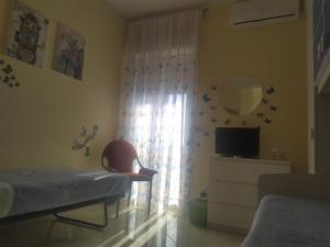 TV a/nebo společenská místnost v ubytování Serenity House di Valeria Favara