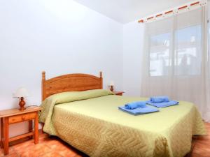 A bed or beds in a room at Apartment Barlovento by Interhome