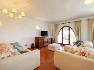 Televízia a/alebo spoločenská miestnosť v ubytovaní Villa Bianca by Interhome