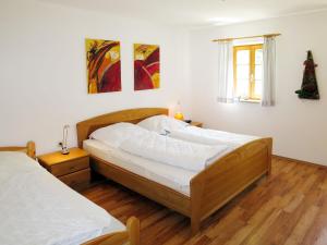 a bedroom with two beds and a window at Holiday Home Kreuzbuche by Interhome in Viechtach