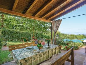 a table on the patio of a house at Holiday Home Villetta nel Verde by Interhome in Montaione