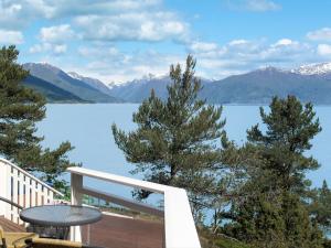 a view of the lake from the balcony of a house at Holiday Home Lyktvorholmen - FJS618 by Interhome in Hopperstad