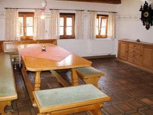 a dining room with a table and a kitchen at Holiday Home Mader by Interhome in Hochbruck