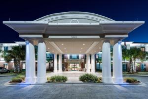 a large building with columns in front of a building at Holiday Inn Express & Suites Florence I-95 & I-20 Civic Ctr, an IHG Hotel in Florence