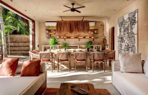 a dining room with a table and chairs at Privada Soliman Bay villa pets welcome! in Tulum