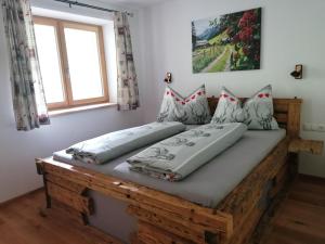 Postel nebo postele na pokoji v ubytování Alpen-Appartement Auerhof