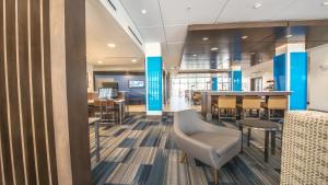 an office lobby with a table and chairs at Holiday Inn Express & Suites - Dripping Springs - Austin Area by IHG in Dripping Springs