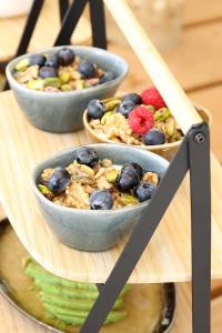 two bowls of food on a table with fruit at Casa Bodhi Boutique Hotel & Spa in Marbella