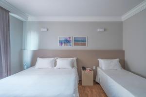 Postel nebo postele na pokoji v ubytování Hotel Melo