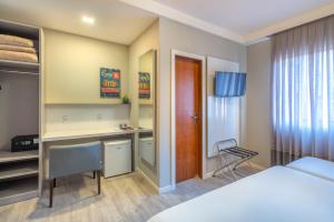 Postel nebo postele na pokoji v ubytování Hotel Melo