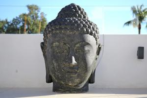 a statue of a head on display in front of a building at Casa Bodhi Boutique Hotel & Spa in Marbella