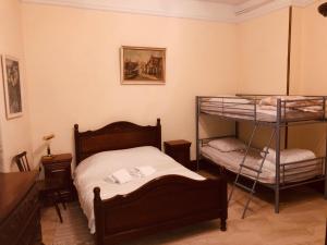 a bedroom with two bunk beds and a desk at Domaine Du Bas De Chene in Saint-Sernin-du-Bois +30 photos