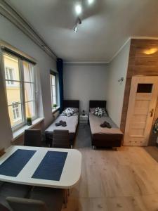 Postel nebo postele na pokoji v ubytování Ratuszowy49