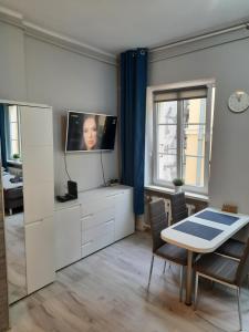 TV a/nebo společenská místnost v ubytování Ratuszowy49