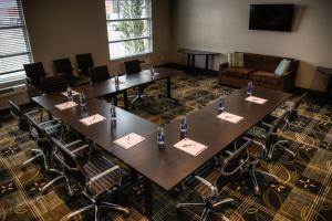 a large conference room with tables and chairs at Holiday Inn Express & Suites Spruce Grove - Stony Plain by IHG in Spruce Grove +37 photos