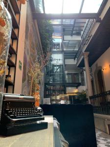 a keyboard sitting on a table in a building at Casa Prim Hotel Boutique in Mexico City