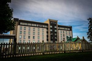 a building with a fence in front of it at Staybridge Suites - Waterloo - St. Jacobs Area in Waterloo
