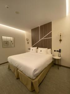 Postel nebo postele na pokoji v ubytování Ansares Hotel