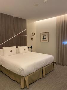 Postel nebo postele na pokoji v ubytování Ansares Hotel