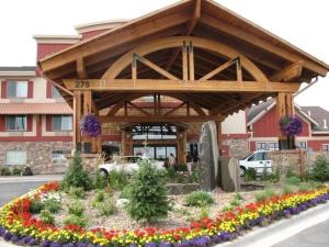 a pavilion with flowers in front of a building at Holiday Inn Express Hotel & Suites Kalispell by IHG in Kalispell