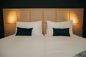 Hotel Dakota客房内的一张或多张床位