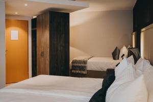 Hotel Dakota客房内的一张或多张床位