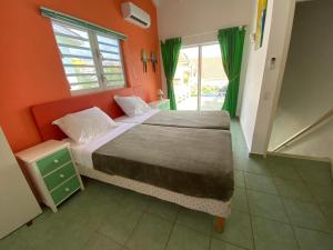 A bed or beds in a room at Heliemar