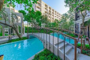 a pool in the courtyard of a apartment building at La Casita Hua Hin Pool and Garden View in Hua Hin