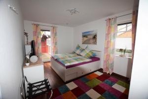 Ένα ή περισσότερα κρεβάτια σε δωμάτιο στο Ferienhaus-MEERzeit