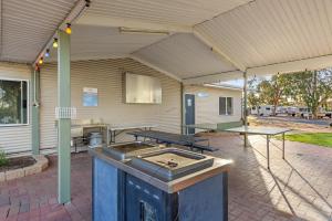 
a kitchen with a stove and a sink at Discovery Parks - Port Augusta in Port Augusta
