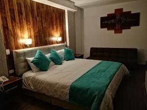 Postel nebo postele na pokoji v ubytování Hotel Chimborazo Internacional