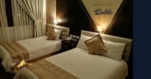Postel nebo postele na pokoji v ubytování Hotel Chimborazo Internacional
