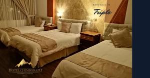 Postel nebo postele na pokoji v ubytování Hotel Chimborazo Internacional
