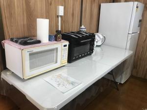 a microwave and a refrigerator on a table at Belalie Wines in Jamestown +8 photos