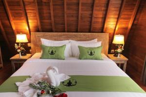 Postel nebo postele na pokoji v ubytování Alam Kawi Ubud Resort & Spa