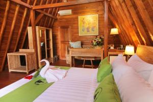 Postel nebo postele na pokoji v ubytování Alam Kawi Ubud Resort & Spa