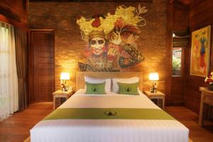 Postel nebo postele na pokoji v ubytování Alam Kawi Ubud Resort & Spa