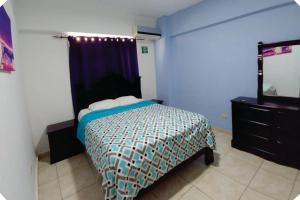 Postel nebo postele na pokoji v ubytování Hostal Magisterial Santo Domingo