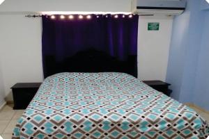 Postel nebo postele na pokoji v ubytování Hostal Magisterial Santo Domingo