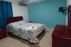 Postel nebo postele na pokoji v ubytování Hostal Magisterial Santo Domingo