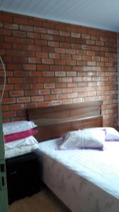 Tempat tidur dalam kamar di Casa de Praia para veraneio - temporada Balneário Gaivotas-SC Família Kunhasky