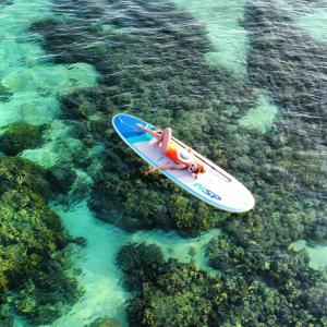 a kayak floating in the water over the reef at Lipe Beach Resort in Ko Lipe