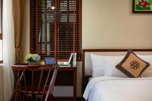 Voodi või voodid majutusasutuse Midori Boutique Hotel toas