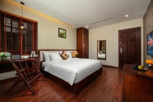 Voodi või voodid majutusasutuse Midori Boutique Hotel toas