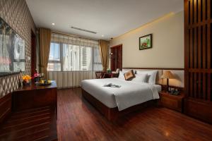 Voodi või voodid majutusasutuse Midori Boutique Hotel toas