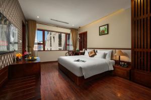 Voodi või voodid majutusasutuse Midori Boutique Hotel toas