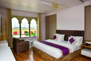 Postel nebo postele na pokoji v ubytování Hotel Siddharsh Heritage