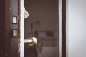 a close up of a door with a gold door knob at Hotell Villa Borgen in Visby