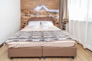 Кровать или кровати в номере Hotel Du Col